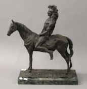 A bronze model of an Native American Indian on horseback. 46 cm high.