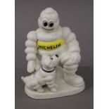 A cast iron Michelin Man and Dog figure. 20 cm high.