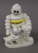 A cast iron Michelin Man and Dog figure. 20 cm high.