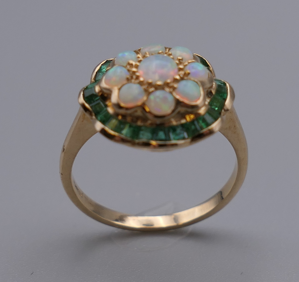 A 9 ct gold, opal and emerald ring. Ring size L/M. 2.6 grammes total weight. - Image 2 of 4