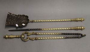 A set of 19th century brass fire irons. The shovel 68.5 cm long.