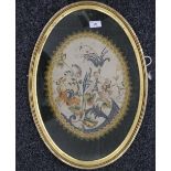 A 19th century floral silk embroidery, housed in an oval frame. 55 cm high overall.
