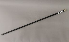 A silver topped walking stick. 91.5 cm long.