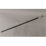 A silver topped walking stick. 91.5 cm long.