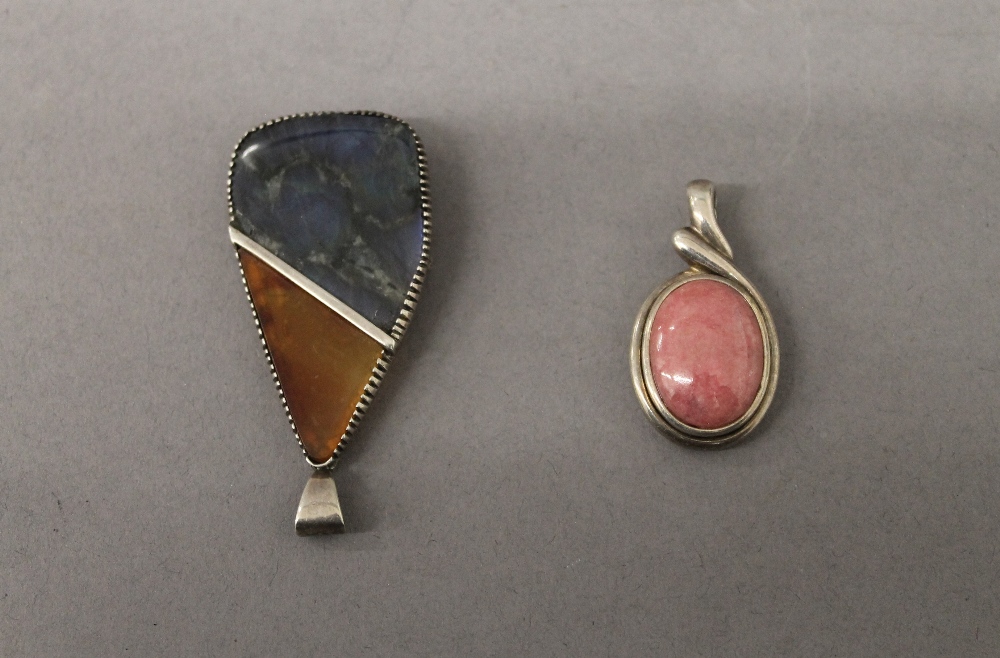 Two silver pendants. The largest 4.5 cm high.