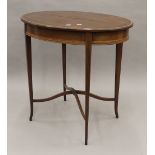 An Edwardian mahogany oval centre table. 73 cm long.