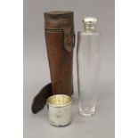 A silver mounted glass spirit flask in leather case. 23 cm high overall.