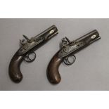 A pair of flintlock man stopper pistols. Each 21 cm long.