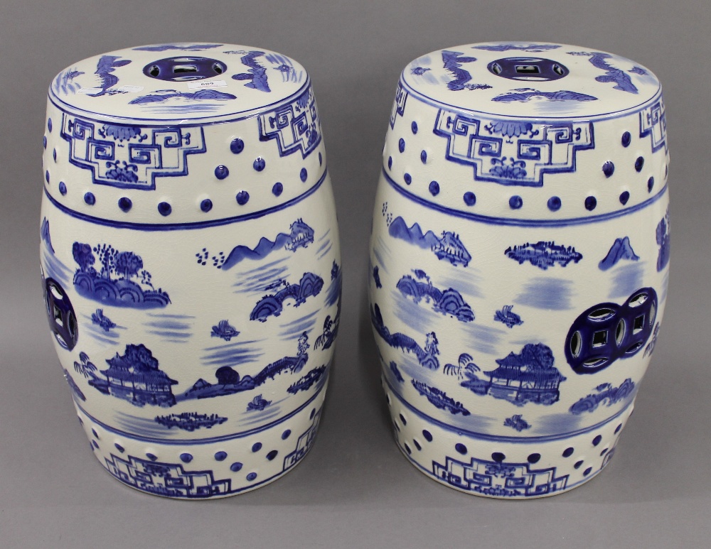 A pair of blue and white porcelain barrel seats. 45 cm high.