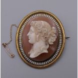 A fine quality 19th century unmarked cameo brooch/pendant. 5.5 cm high. 38.1 grammes total weight.