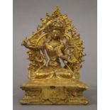A gilt bronze model of buddha. 17.5 cm high.