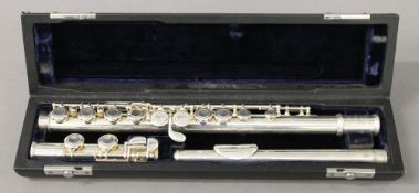 A cased flute by Trevor James of London.