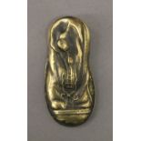 A brass vesta formed as a boot. 7 cm long.