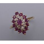 A 9 ct gold multi-stone ruby and diamond ring. Ring Size L. 1.9 grammes total weight.