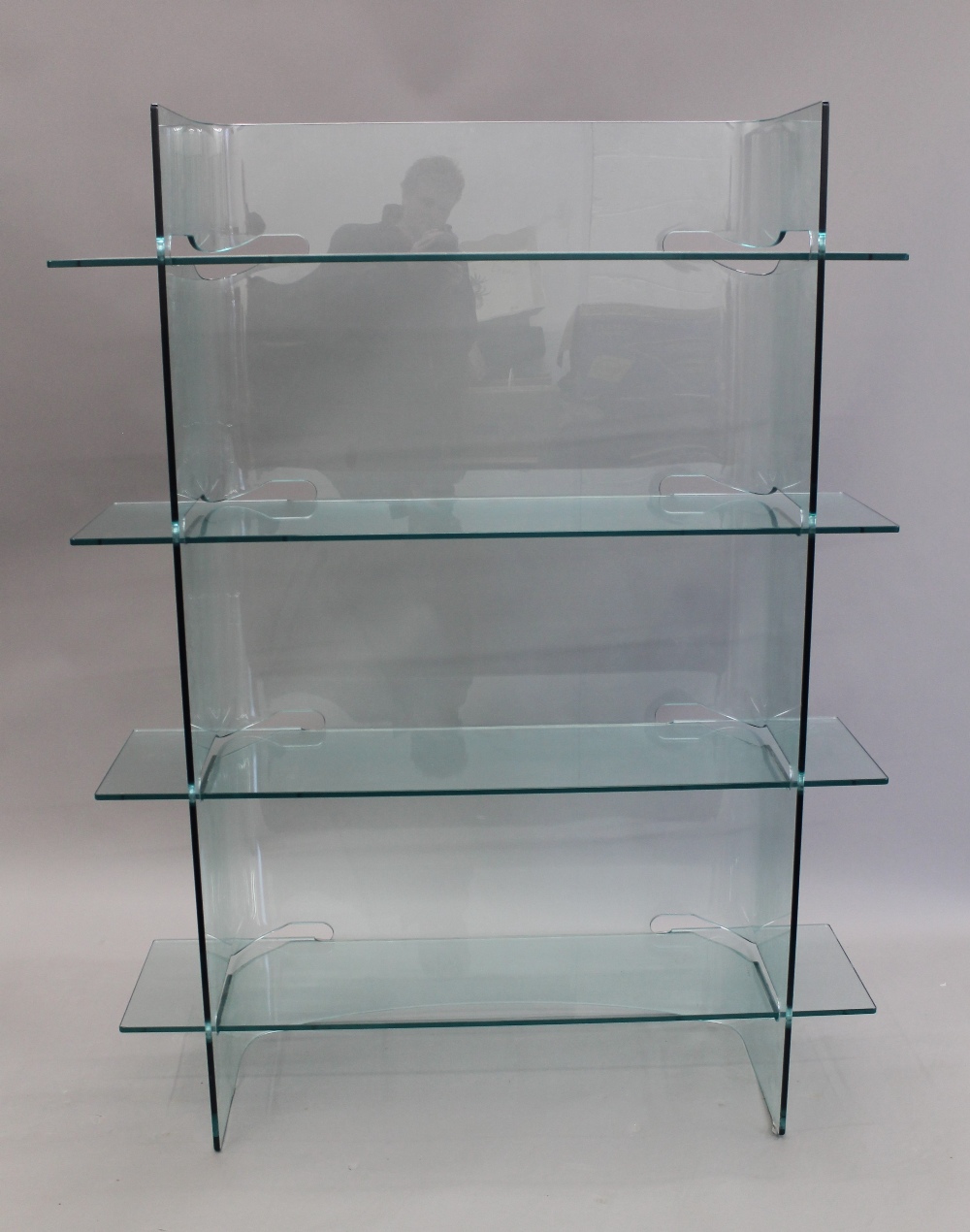 A modern glass bookcase and a modern television stand. The former 155 cm high x 120 cm wide.