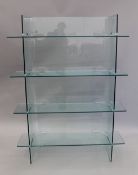 A modern glass bookcase and a modern television stand. The former 155 cm high x 120 cm wide.