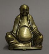 A polished brass model of buddha. 13 cm high.