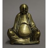 A polished brass model of buddha. 13 cm high.