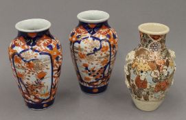 Two late 19th century Imari vases and a Satsuma vase. The latter 15 cm high.