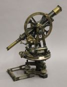 A Victorian Carey brass theodolite. 43 cm high.