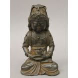 A Chinese bronze Buddha with dark patination. 18.5 cm high.