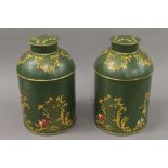 A pair of green toleware tea tins. 36 cm high.