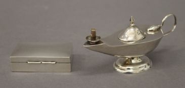 A 925 silver table lighter formed as an oil lamp and a miniature silver snuff box in the form of a