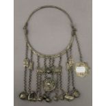 A Chinese white metal necklace set with dogs-of-fo. 14 cm diameter.