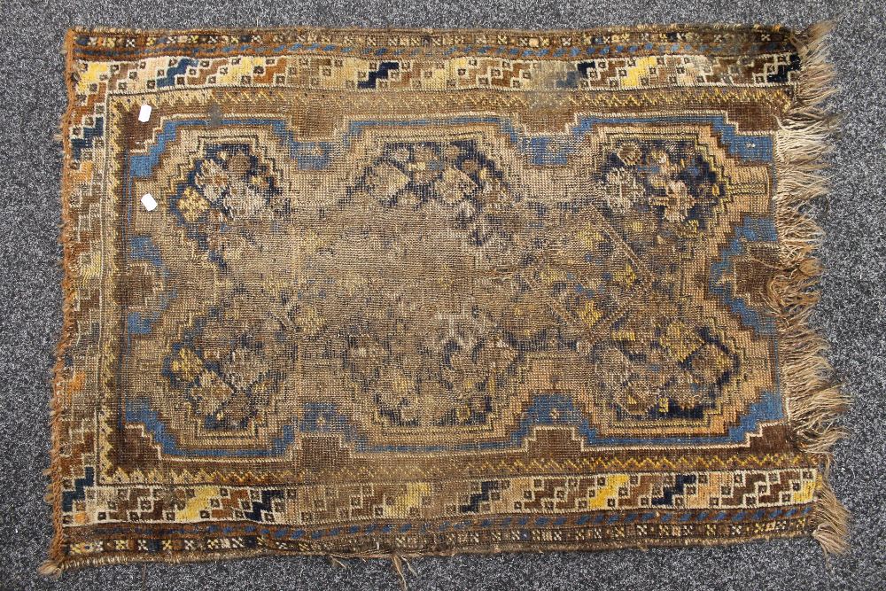 A small antique rug. 105 x 76 cm.