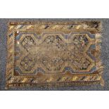 A small antique rug. 105 x 76 cm.