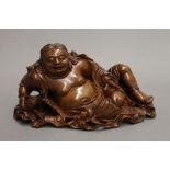 A 19th century Chinese wood carving of a reclining buddha. 26 cm wide.