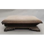 A large Victorian carved oak footstool (converted). 132 cm long.