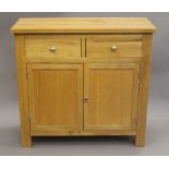 A modern oak side cupboard. 96 cm wide.