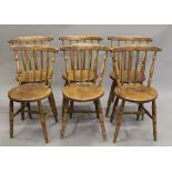 A set of six elm seated stick back kitchen chairs