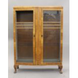 An early 20th century walnut display cabinet. 87 cm wide.