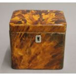 An early 19th century tortoiseshell tea caddy. 11 cm wide.