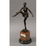 An Art Deco style bronze model of a dancing girl. 48 cm high.