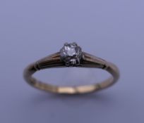 An 18 ct gold diamond solitaire ring. Ring size O. 2.4 grammes total weight.