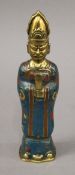 A Chinese bronze cloisonne attendant figure. 25 cm high.