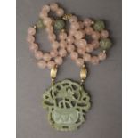 A rose quartz and jade necklace. 58 cm long.