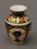 A small Royal Crown Derby vase. 8.5 cm high.