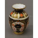 A small Royal Crown Derby vase. 8.5 cm high.