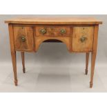 A Victorian inlaid mahogany bow front sideboard. 107 cm wide.