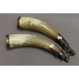 A pair of 19th century horn shot and powder flasks. Each approximately 36 cm long.