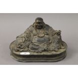 A bronze model of buddha seated. 33 cm wide.