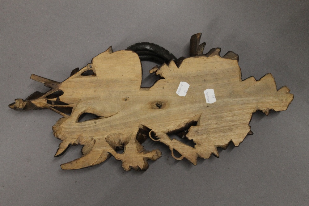 A Blackforest carved wooden wall hanging formed as a goat and a bird. 47 cm long. - Image 2 of 2