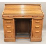 An early 20th century oak roll top desk. 121 cm wide.