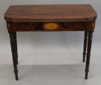 A 19th century mahogany card table. 91 cm wide.