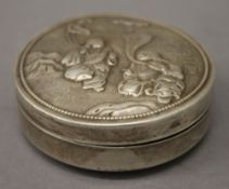 A Chinese silver circular box. 8 cm diameter.