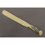 A 19th century ivory page turner with silver pierced work to handle. 31.5 cm long.
